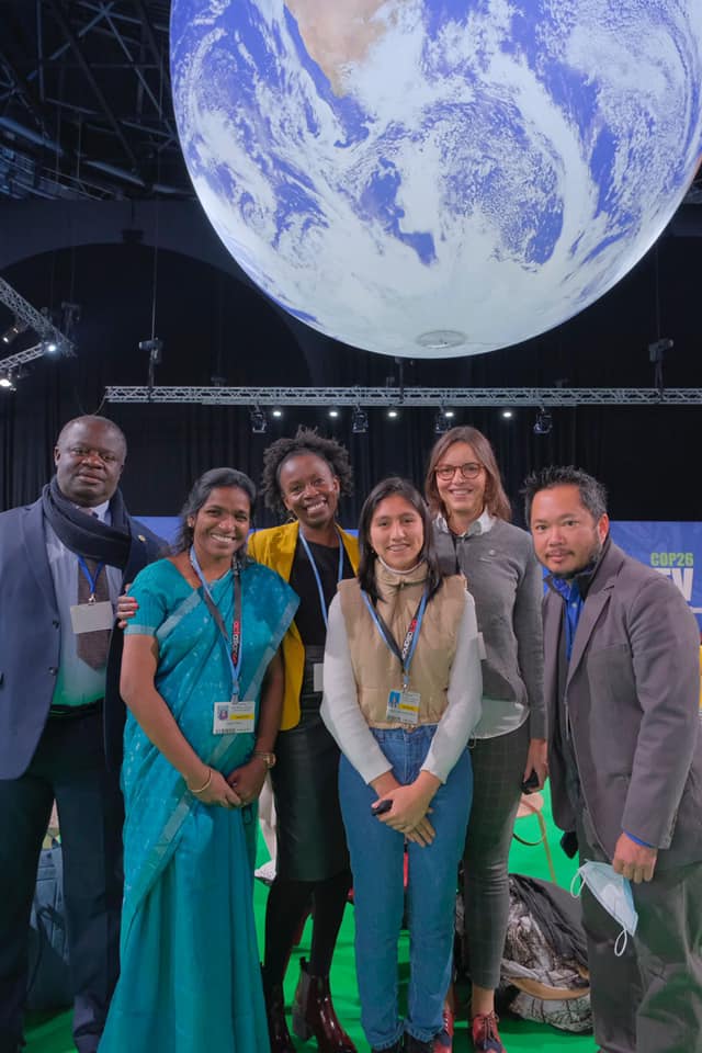WoC staff with others at COP26